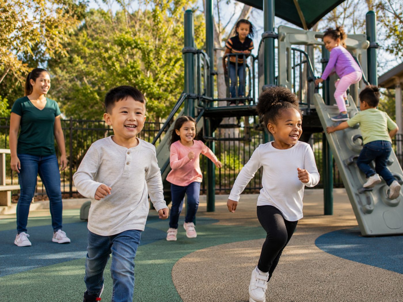 Secure outdoor play area with children playing safely